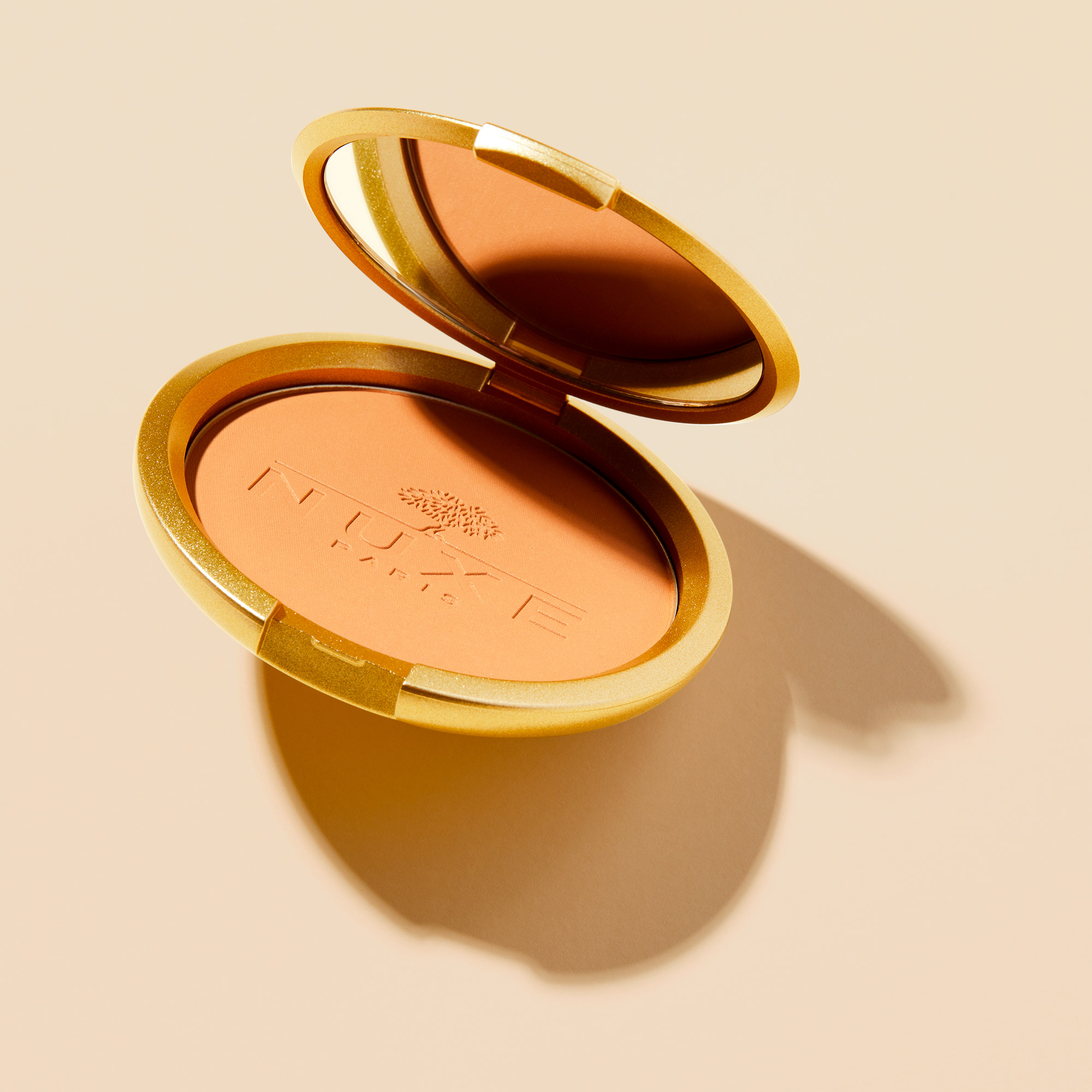 Nuxe Poudre Eclat Prodigieux Çok Amaçlı Bronzlaştırıcı Kompakt Pudra 25 gr - Cilde ışıltı ve bronzluk kazandıran, çok amaçlı kompakt bronzlaştırıcı pudra
